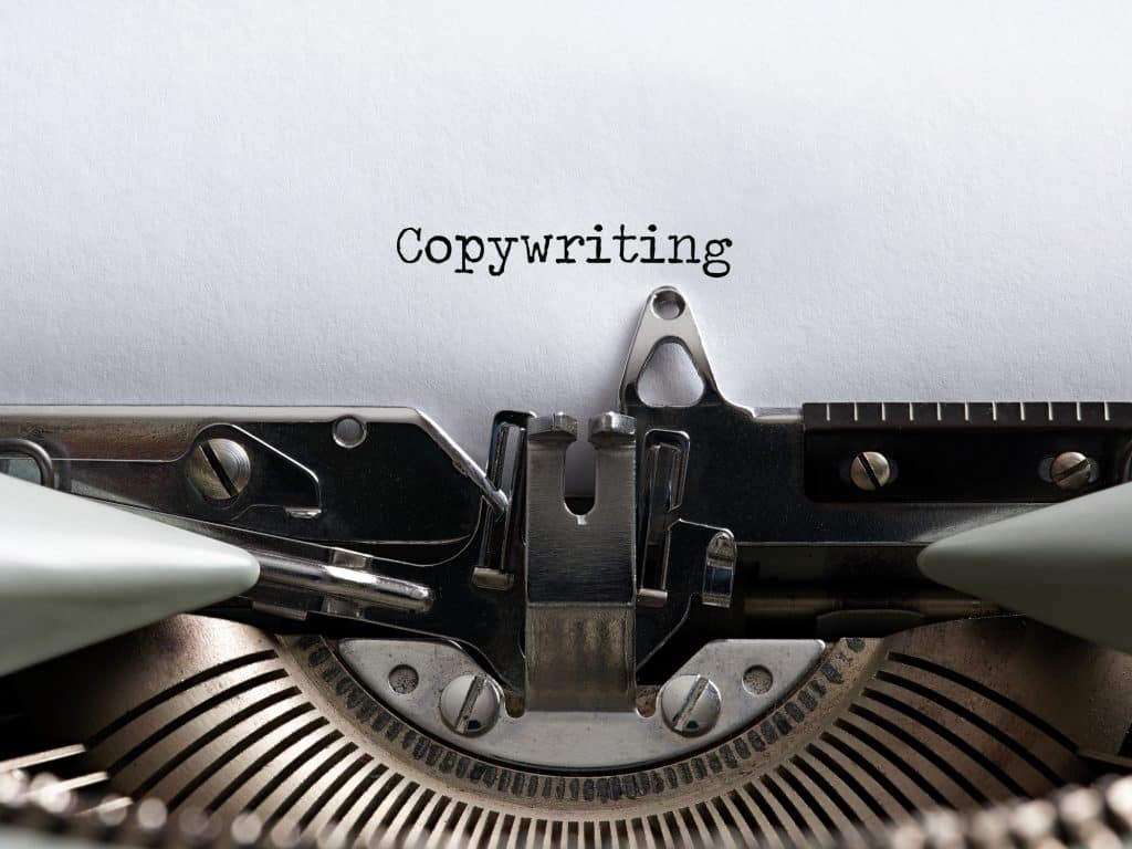 The Ultimate Guide to Choosing the Best Copywriting Service | Tailored Ink | Copywriting and marketing agency | The word copywriting written with a vintage typewriter. Marketing and advertising concept copywriter.