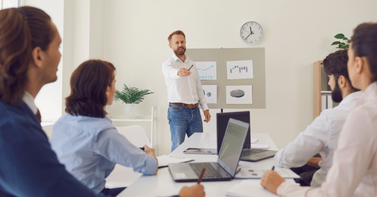 Fractional CMO addressing his team during a meeting